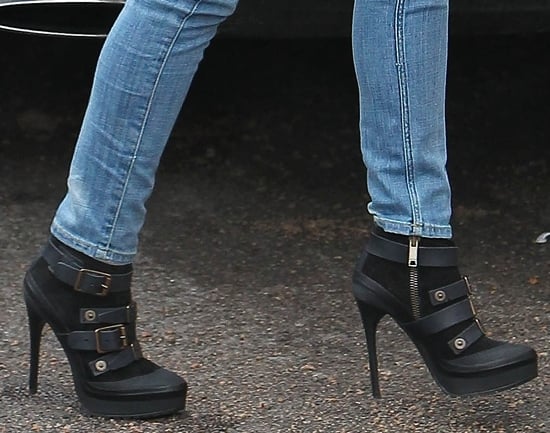 Cheryl Cole styled her jeans with towering black boots