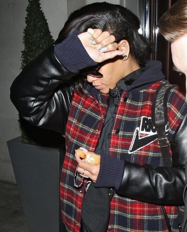 Rihanna eats an orange as she leaves 45 Park Lane – Dorchester Collection Hotel at 2.30am for the first time since being struck down with a virus after performing on X Factor. London, on November 28, 2012