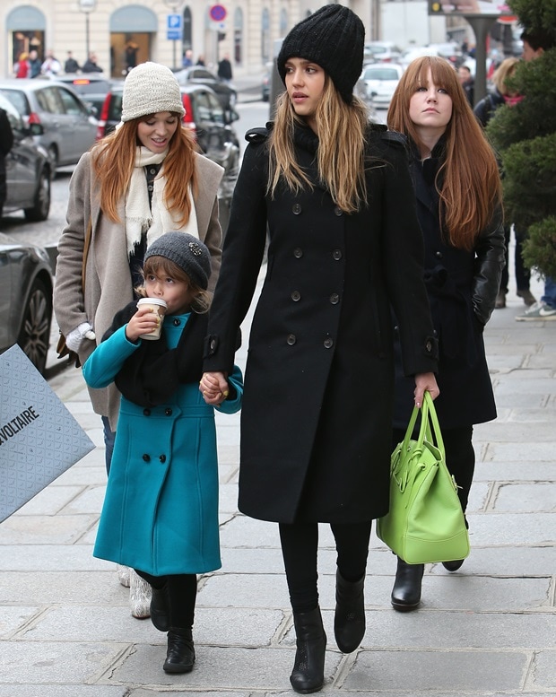 Visiting Paris with her mother Jessica Alba, Honor Marie Warren styled a blue trench coat with a gray beanie and a black scarf