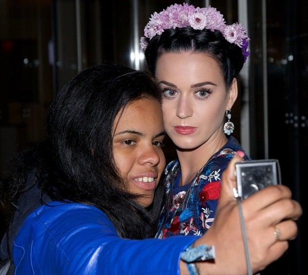 Katy Perry takes a picture with a fan