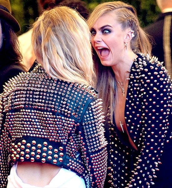 Cara Delevingne hamming it up with Sienna Miller in leather jackets