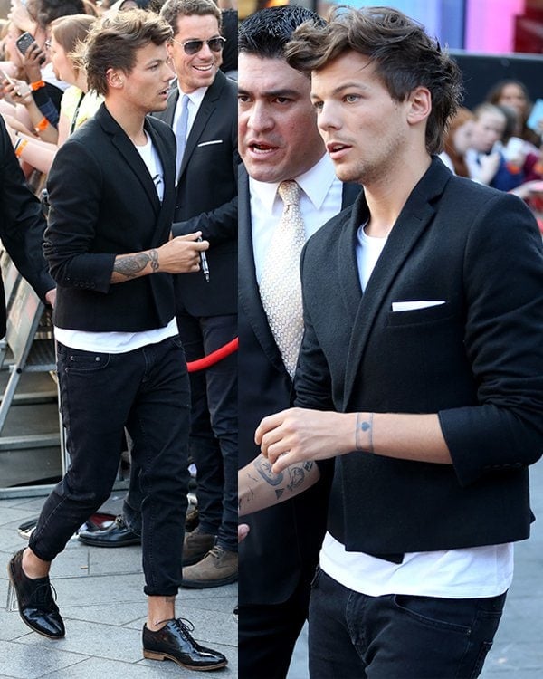Louis Tomlinson in a cropped blazer paired with cropped jeans and leather oxfords at the One Direction: This Is Us world premiere
