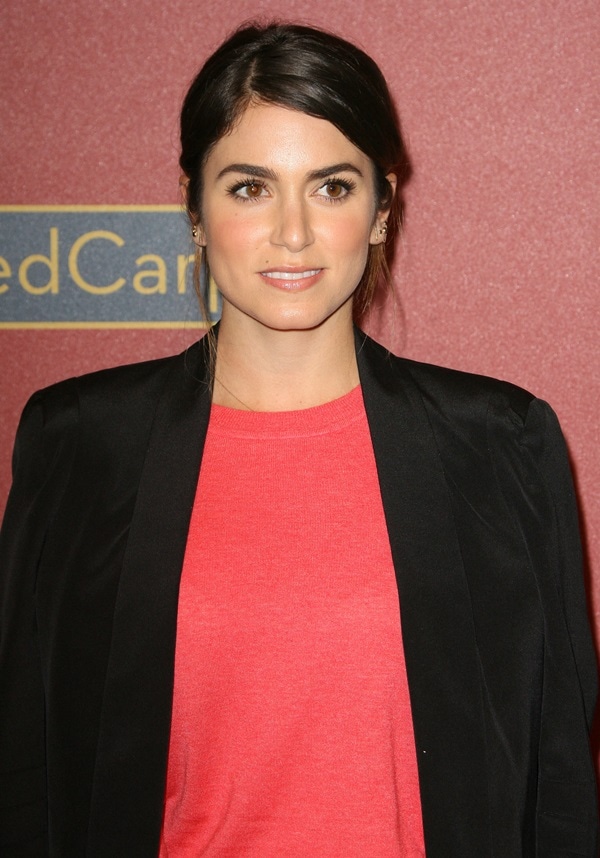 Nikki Reed wore a Tory Burch cashmere sweater with a black Rebecca Minkoff Becky jacket