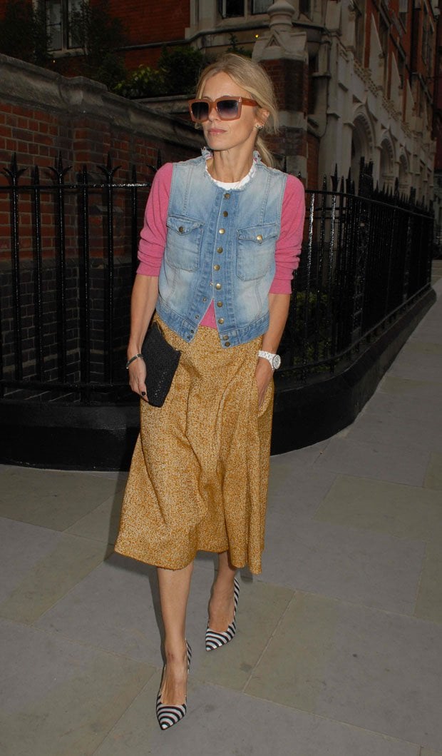 Laura Bailey wears a denim vest over a sweater outside the Chiltern Firehouse restaurant