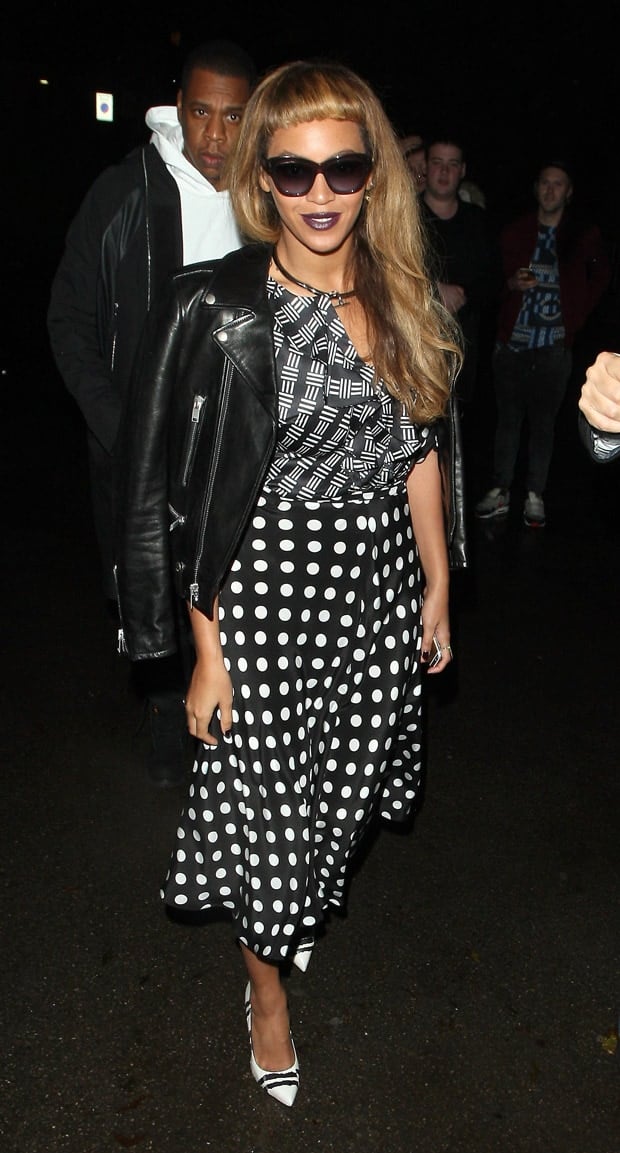 Beyonce styled her leather jacket with Alexander McQueen snakeskin striped pumps, a printed silk blouse, and a polka dot skirt