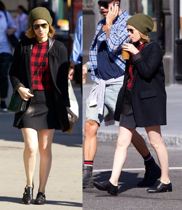 Kate Mara wears a black coat with a mini skirt in the East Village
