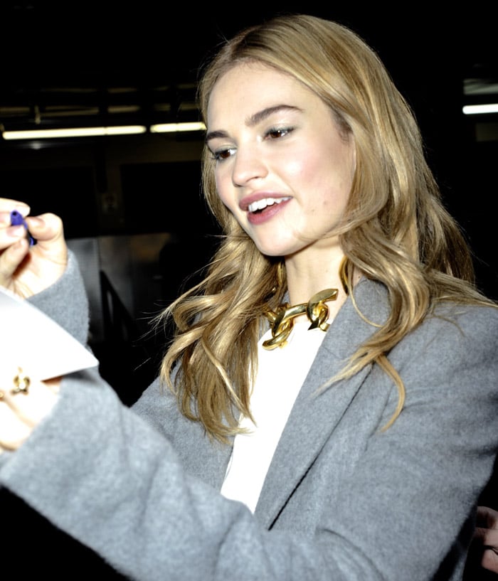 Lily James wears a Mugler grey peacoat while doing press junkets